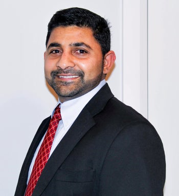 Portrait of Renji Thomas, Associate.